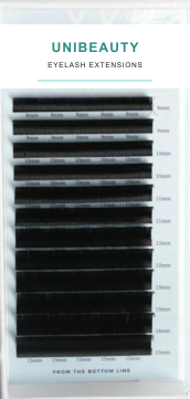 Ultra-matte black individual extension fibers in a professional tray