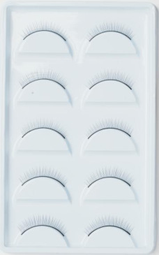 Company-supplied catalog training eyelash strips on a practice tray